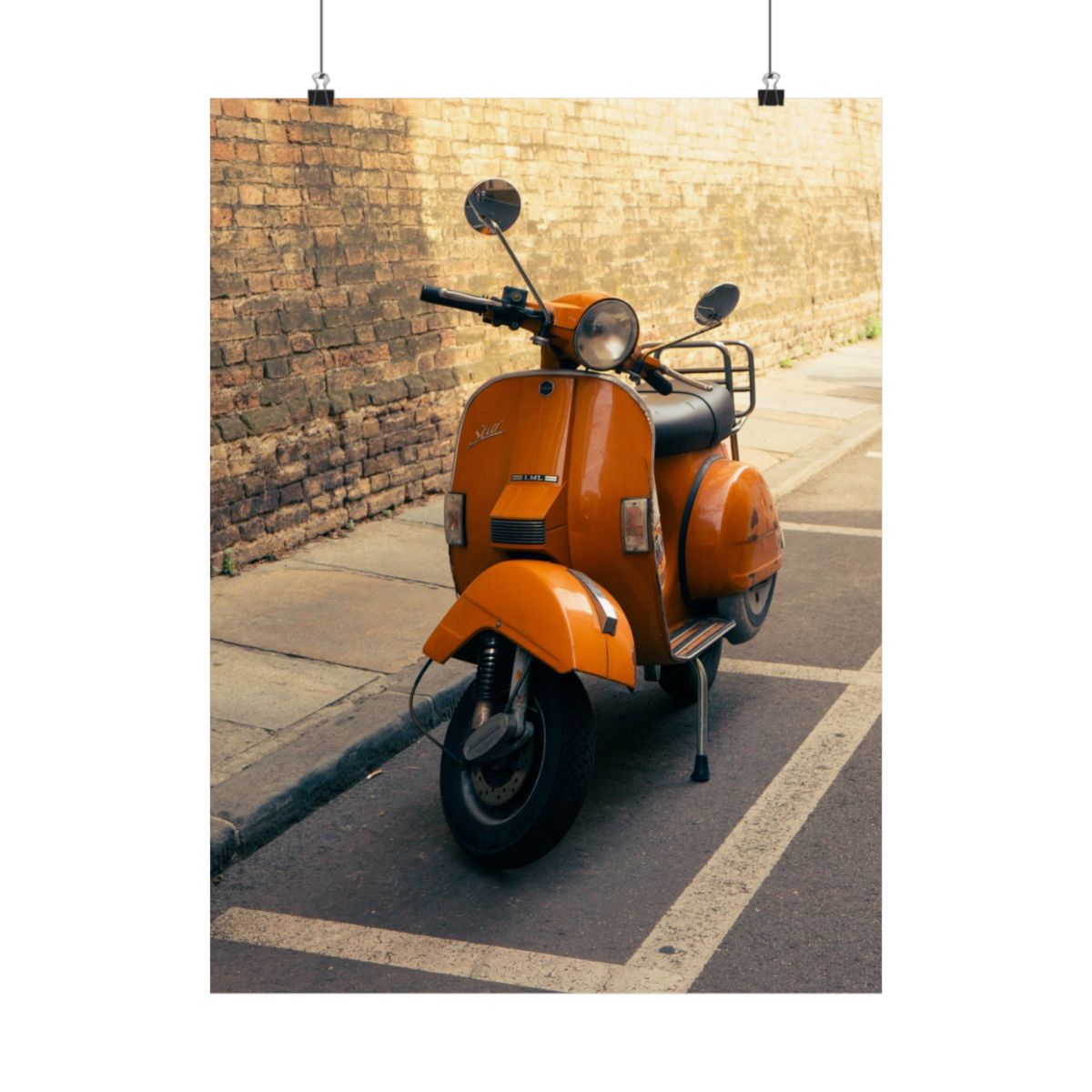 Print Vespa: una Vespa naranja aparcada junto a un muro de ladrillo en Parma.